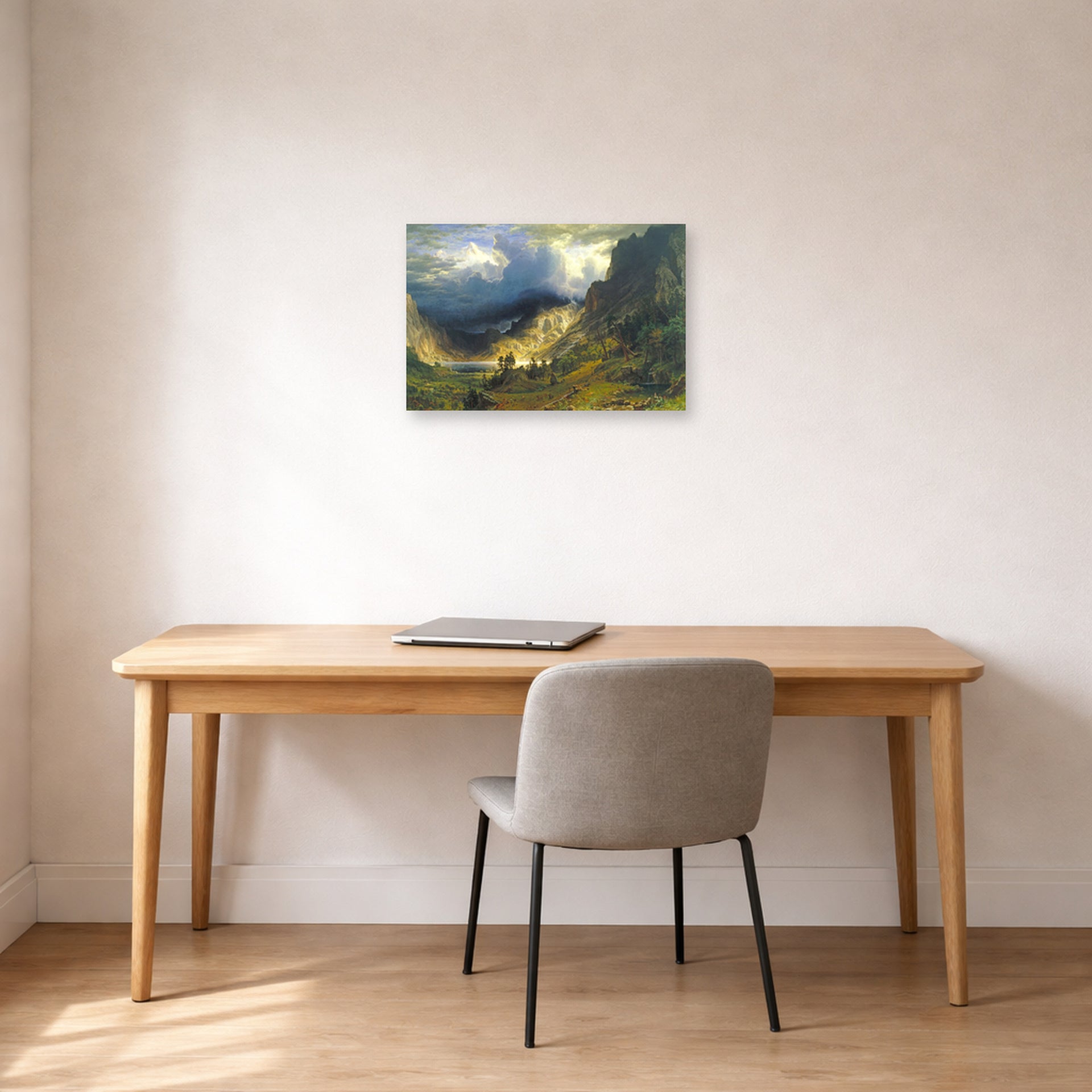 Unframed poster print of Albert Bierstadt's 'A Storm in the Rocky Mountains, Mt. Rosalie' displayed on a wall in a office