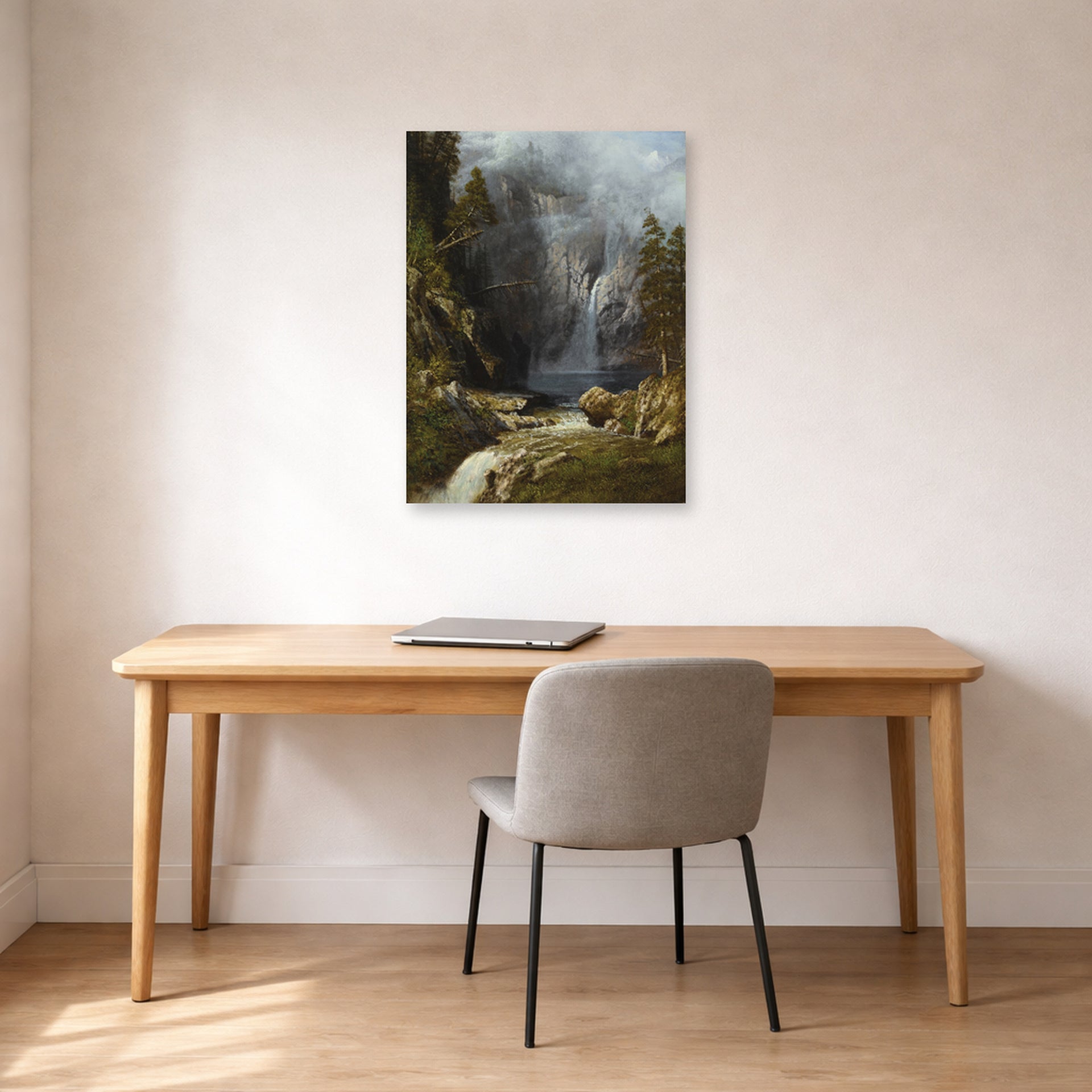 Unframed poster print of Albert Bierstadt's 'A Western Waterfall' displayed on a wall in a office