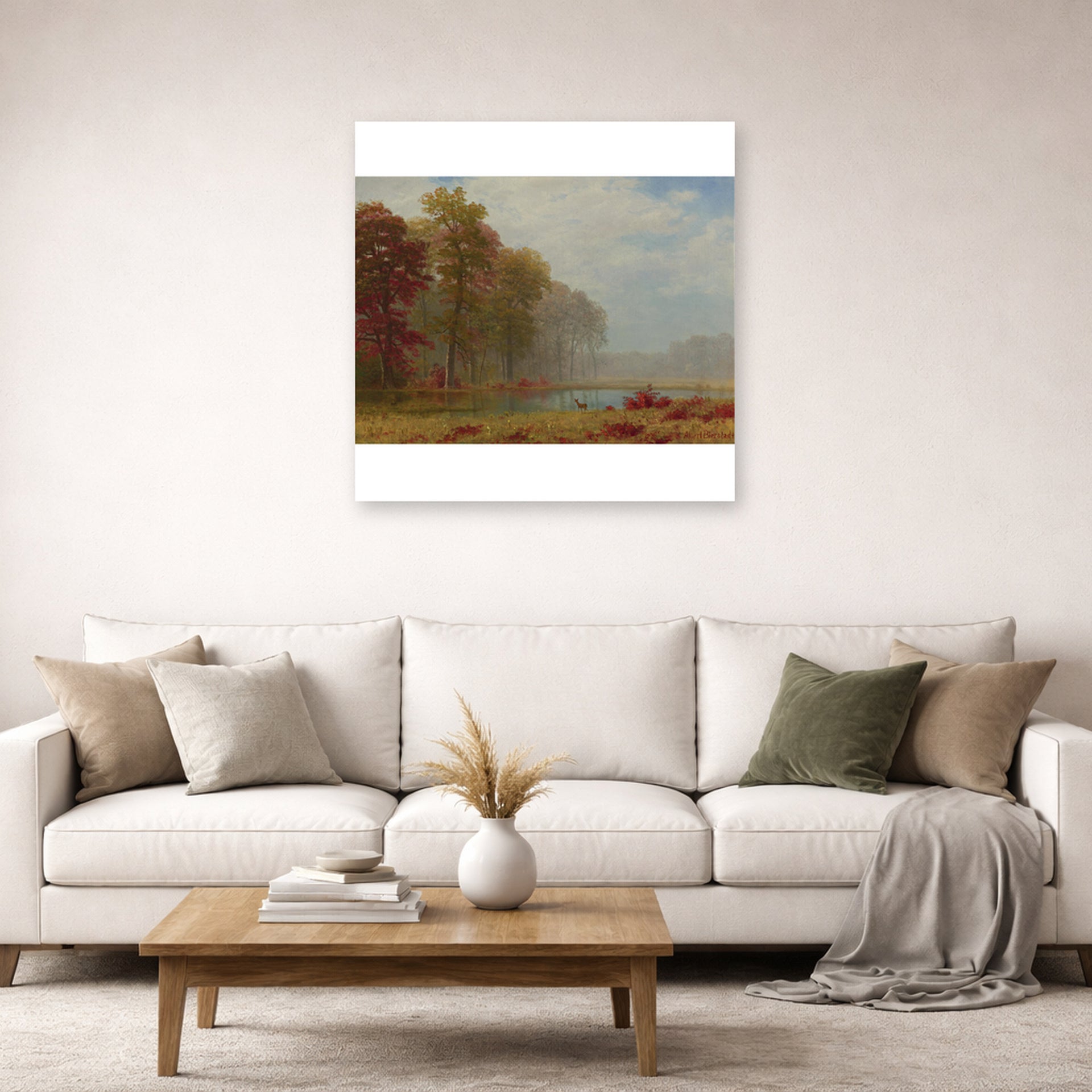 Unframed poster print of Albert Bierstadt's 'Autumn On The River' displayed on a wall in a living room