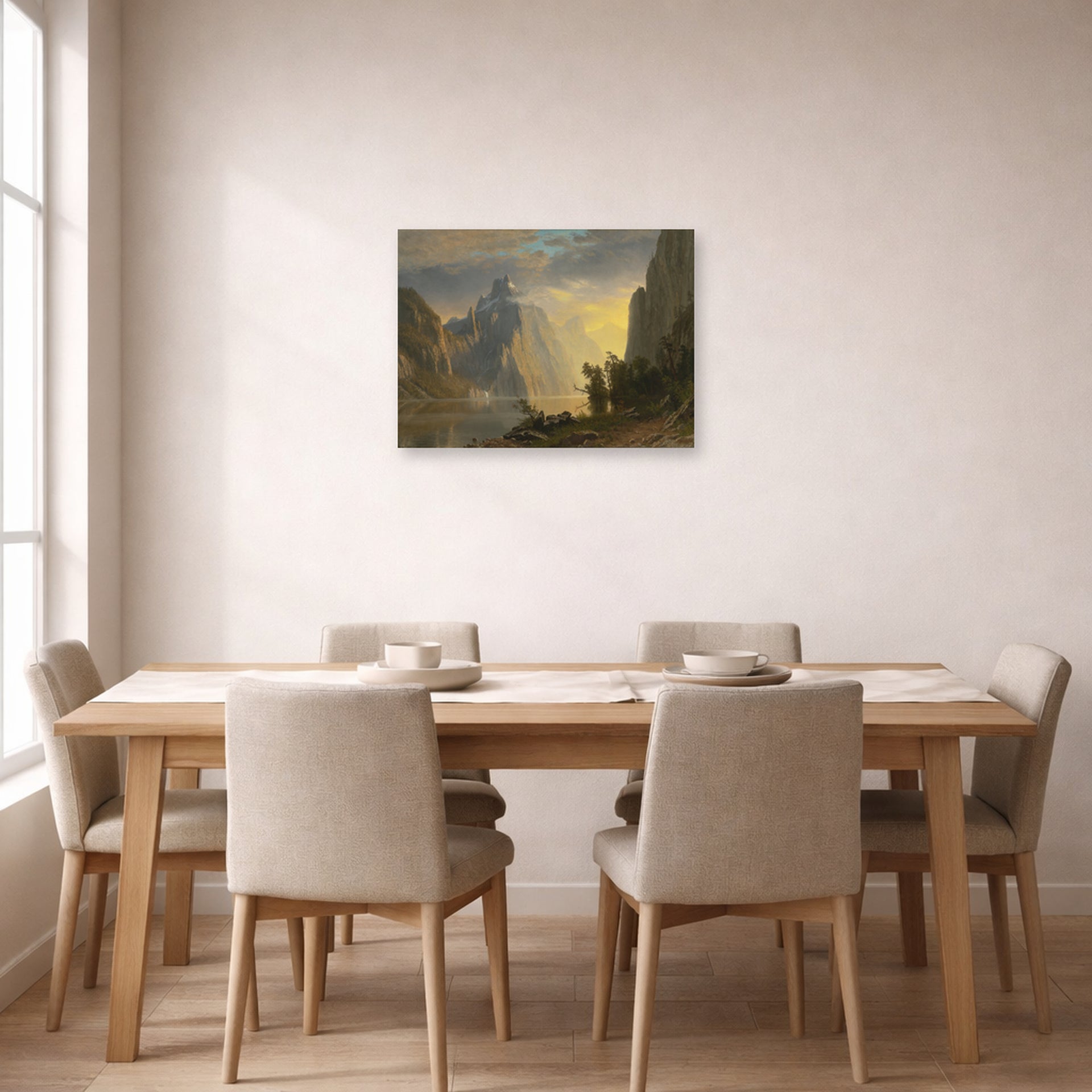 Unframed poster print of Albert Bierstadt's 'Lake in the Sierra Nevada' displayed on a wall in a dining room