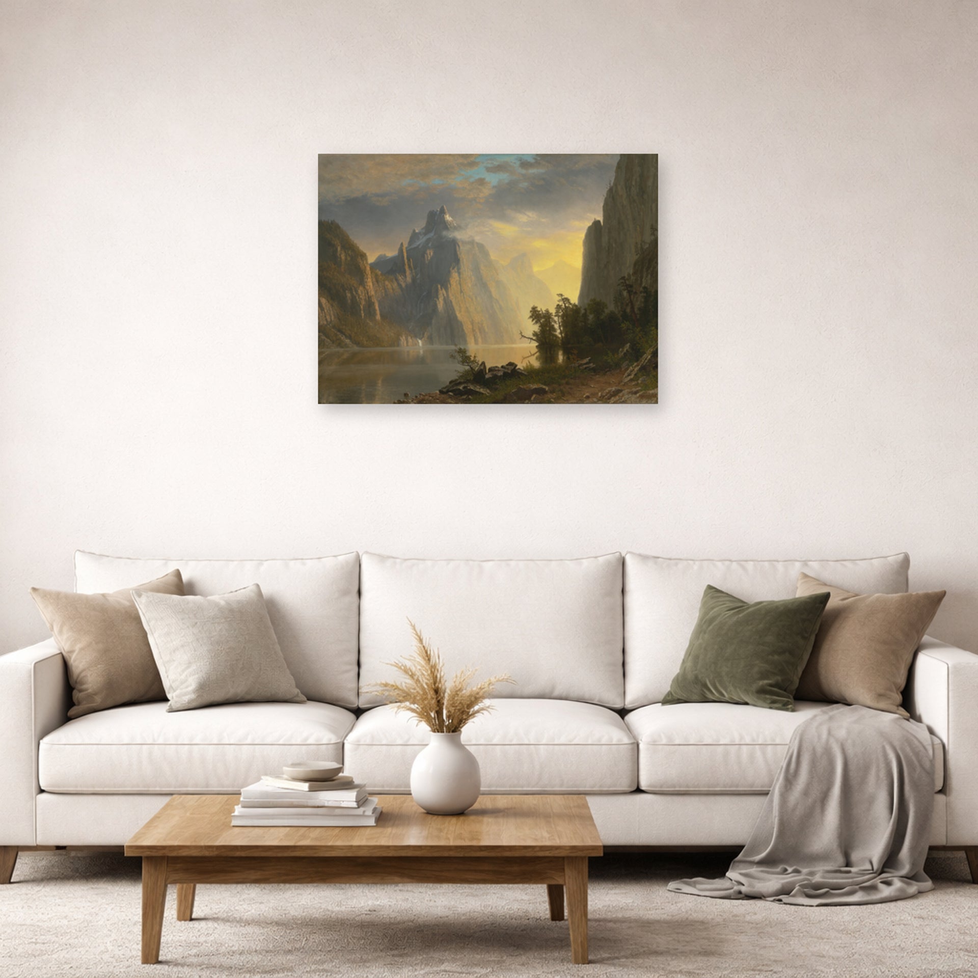 Unframed poster print of Albert Bierstadt's 'Lake in the Sierra Nevada' displayed on a wall in a living room