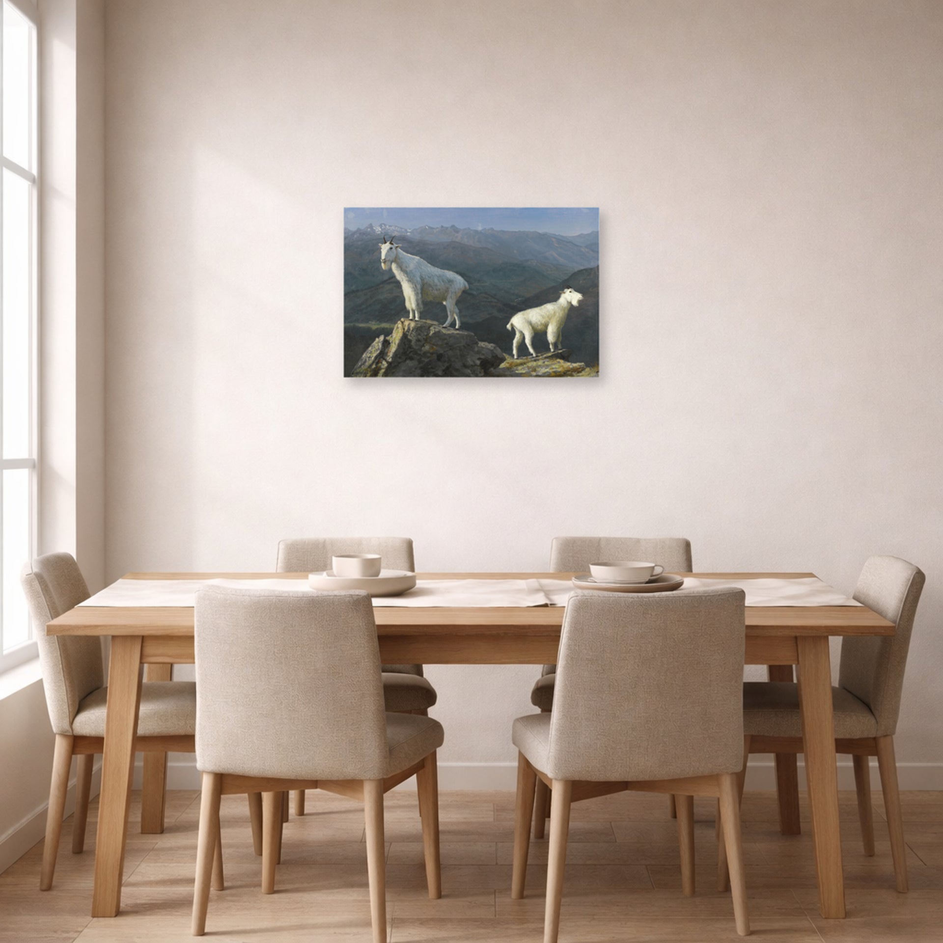 Unframed poster print of Albert Bierstadt's 'Mountain Goats' displayed on a wall in a dining room