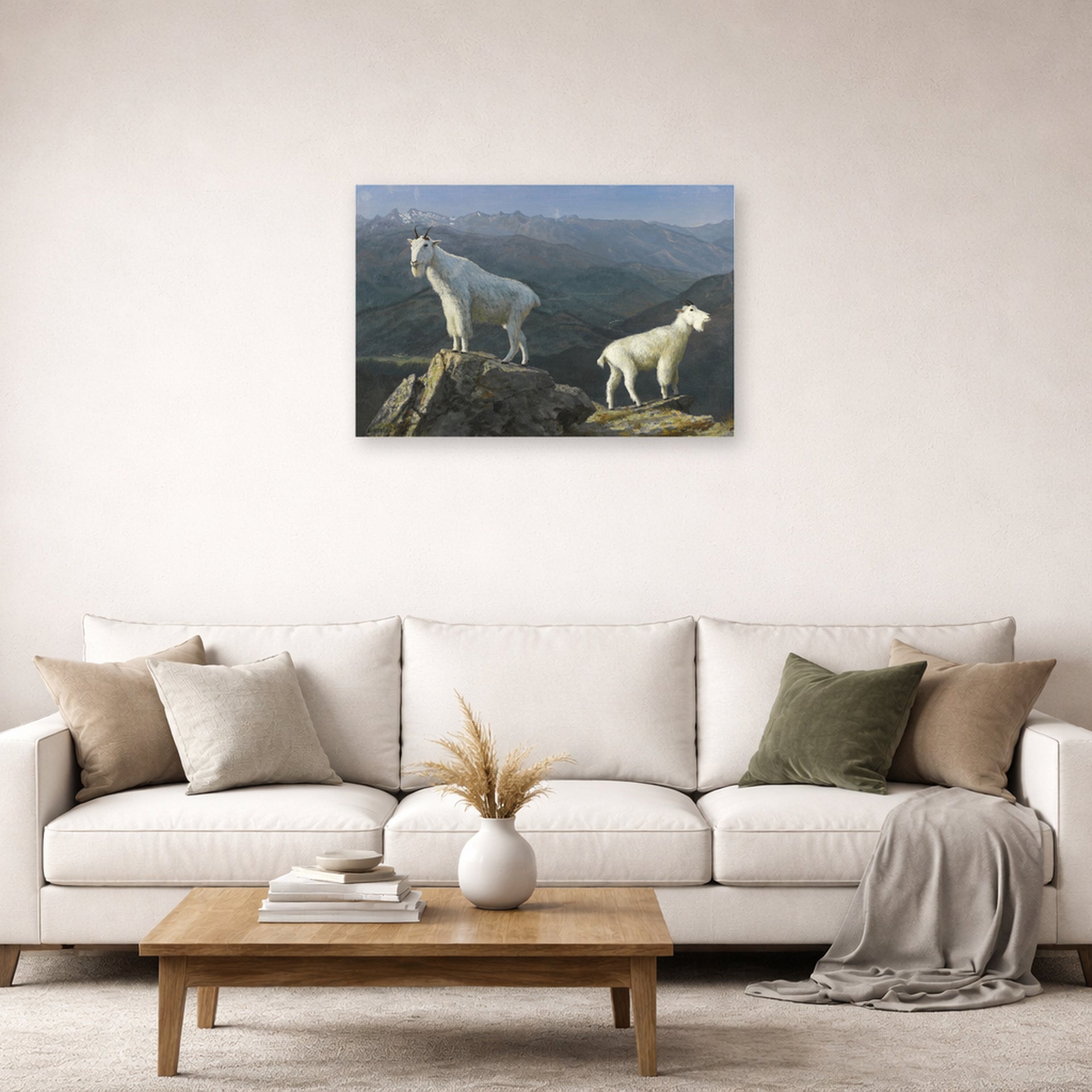 Unframed poster print of Albert Bierstadt's 'Mountain Goats' displayed on a wall in a living room