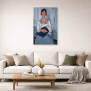 Gallery-wrapped canvas print of Amedeo Modigliani's Gypsy Woman with Baby displayed on a wall in a second living room setting