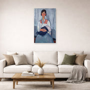 Unframed poster print of Amedeo Modigliani's Gypsy Woman with Baby displayed on a wall in a second living room setting