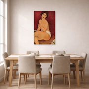 Unframed poster print of Amedeo Modigliani's Nude Sitting on a Divan (La Belle Romaine) displayed on a wall in a dining room