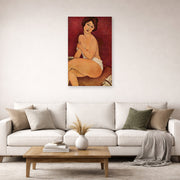 Unframed poster print of Amedeo Modigliani's Nude Sitting on a Divan (La Belle Romaine) displayed on a wall in a second living room setting