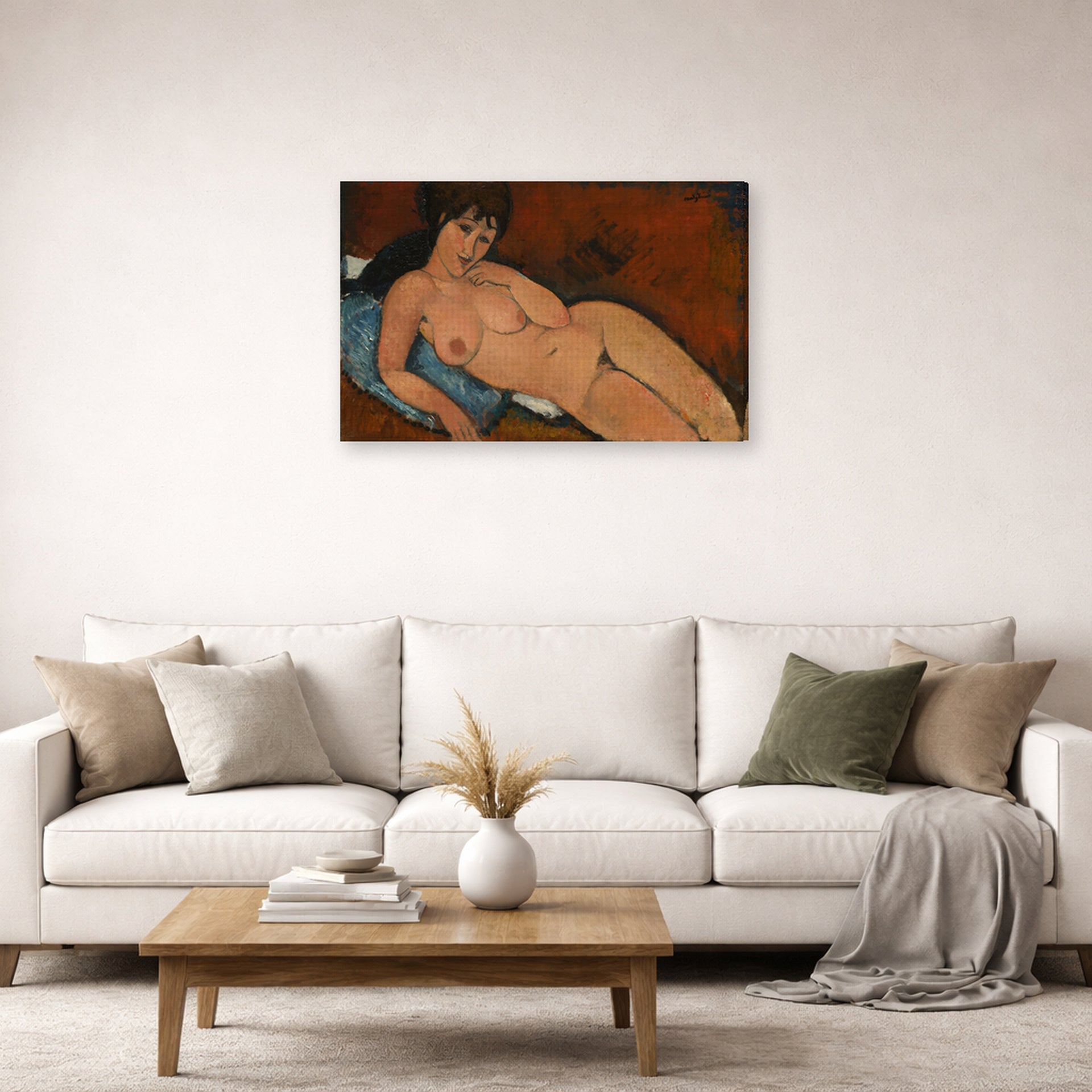 Gallery-wrapped canvas print of Amedeo Modigliani's Nude on a Blue Cushion displayed on a wall in a second living room setting