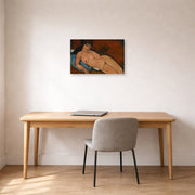 Gallery-wrapped canvas print of Amedeo Modigliani's Nude on a Blue Cushion displayed on a wall in an office
