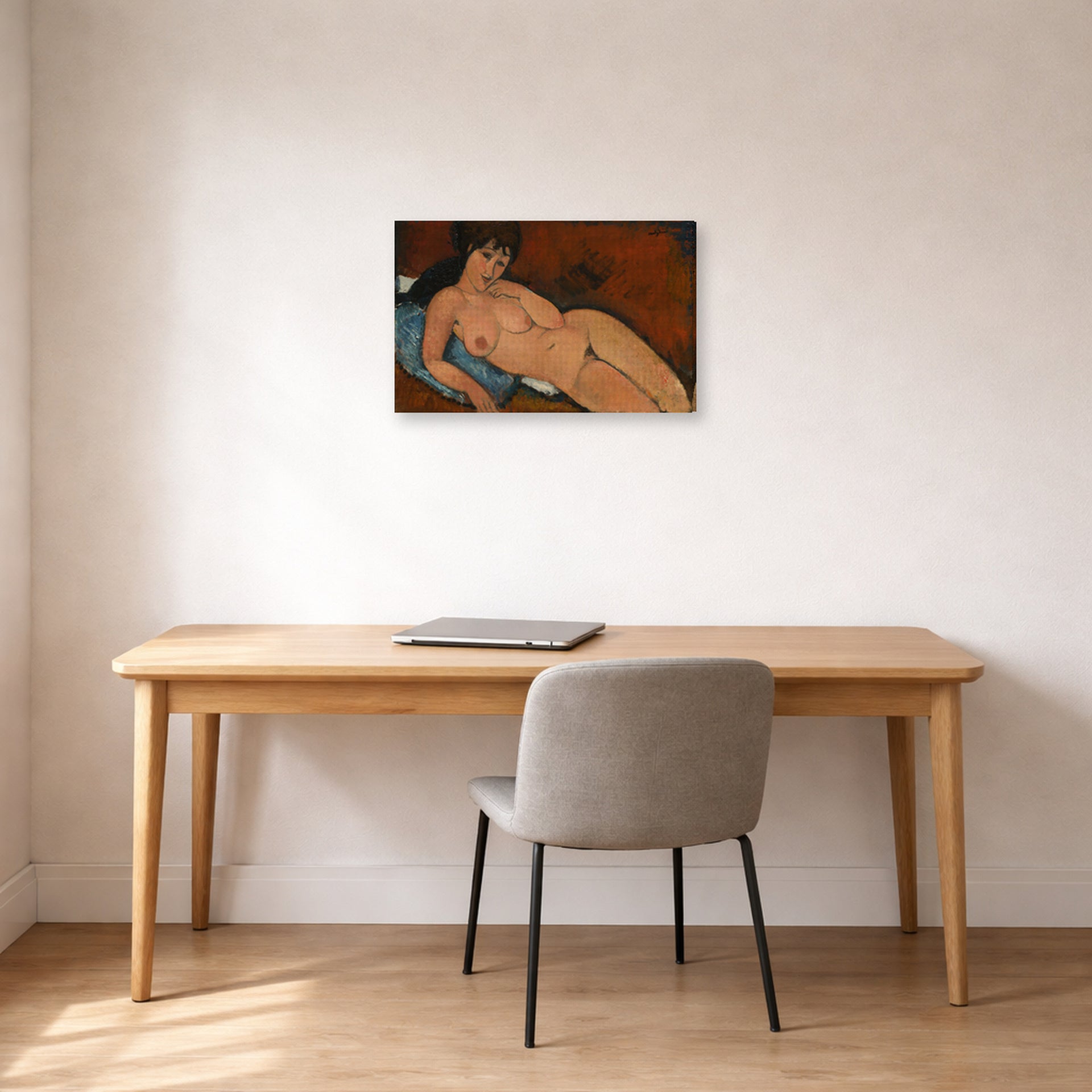 Gallery-wrapped canvas print of Amedeo Modigliani's Nude on a Blue Cushion displayed on a wall in an office