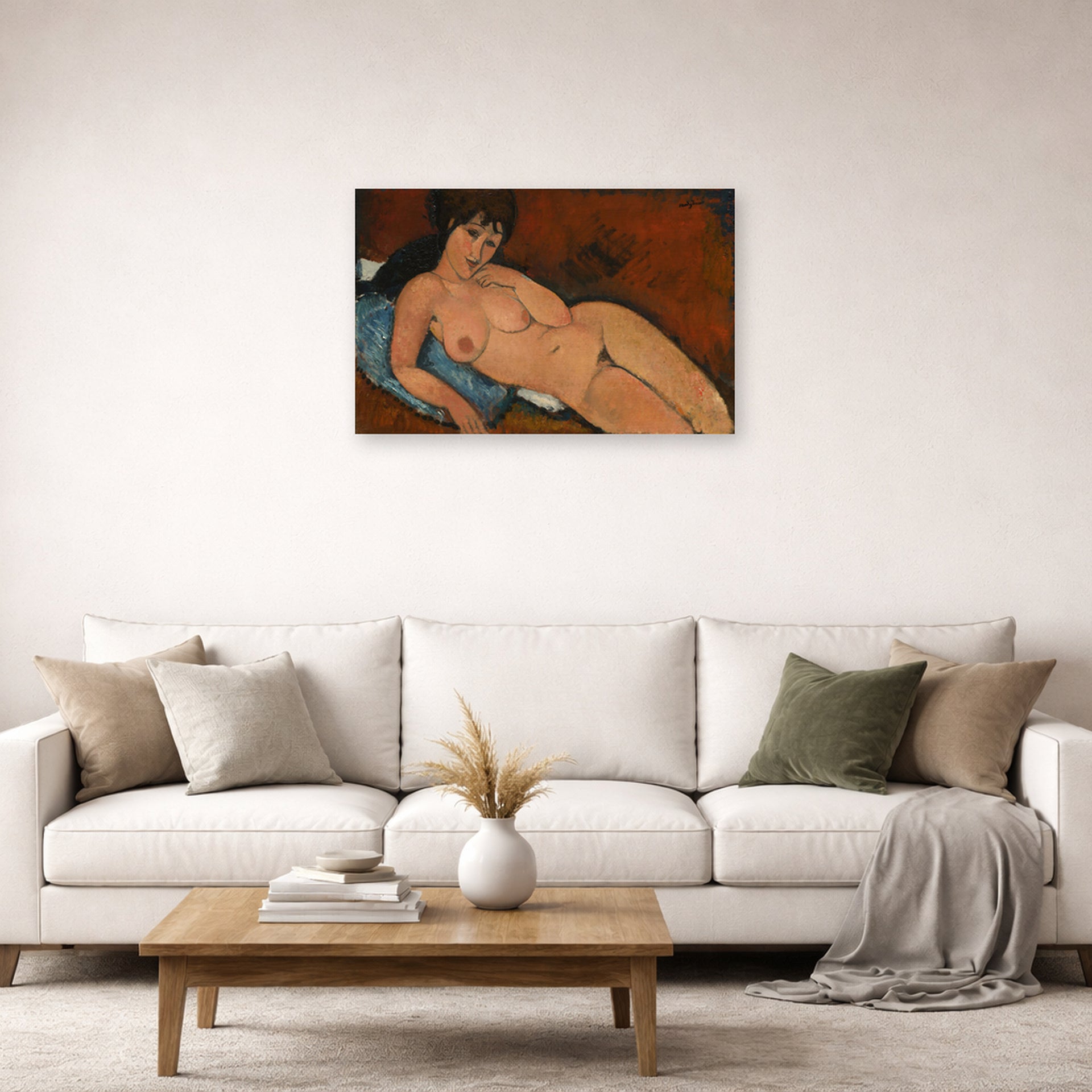 Unframed poster print of Amedeo Modigliani's Nude on a Blue Cushion displayed on a wall in a second living room setting