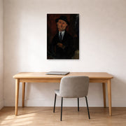 Unframed poster print of Amedeo Modigliani's Paul Guillaume, Novo Pilota displayed on a wall in an office