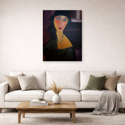 Gallery-wrapped canvas print of Amedeo Modigliani's Portrait of Jeanne Hebuterne displayed on a wall in a second living room setting