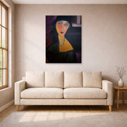 Unframed poster print of Amedeo Modigliani's Portrait of Jeanne Hebuterne displayed on a wall in a living room