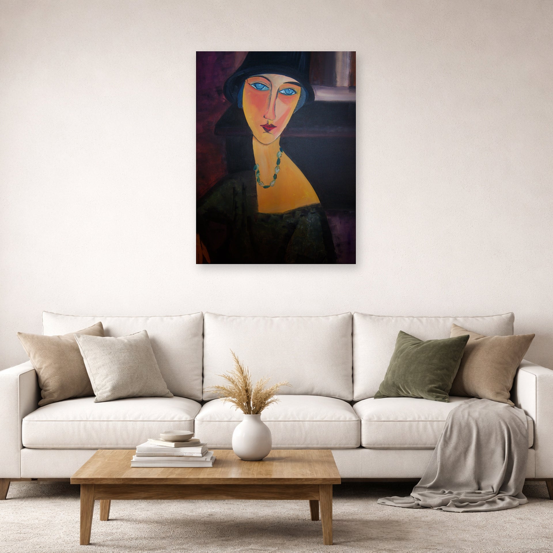 Unframed poster print of Amedeo Modigliani's Portrait of Jeanne Hebuterne displayed on a wall in a second living room setting