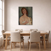 Unframed poster print of Amedeo Modigliani's Portrait of a Young Woman displayed on a wall in a dining room