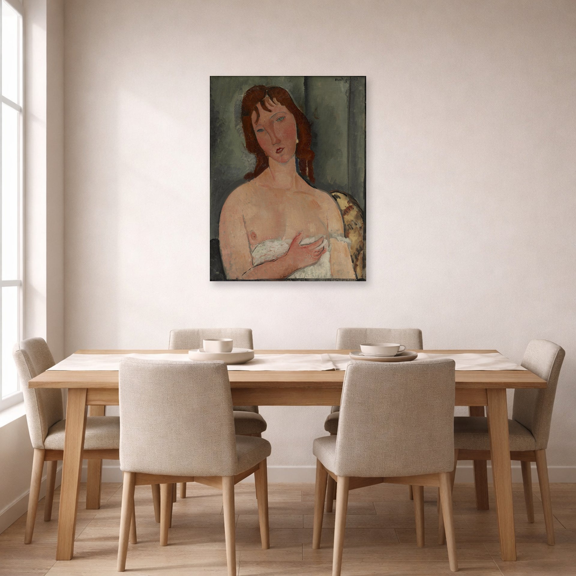 Unframed poster print of Amedeo Modigliani's Portrait of a Young Woman displayed on a wall in a dining room