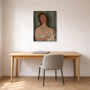 Unframed poster print of Amedeo Modigliani's Portrait of a Young Woman displayed on a wall in an office