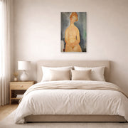 Unframed poster print of Amedeo Modigliani's Seated Nude displayed on a wall in a bedroom