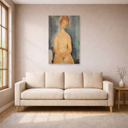 Unframed poster print of Amedeo Modigliani's Seated Nude displayed on a wall in a living room