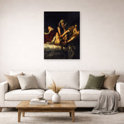 Unframed poster print of Artemisia Gentileschi's Judith Slaying Holofernes displayed on a wall in a living room