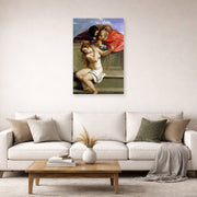Unframed poster print of Artemisia Gentileschi's Susanna and the Elders displayed on a wall in a living room