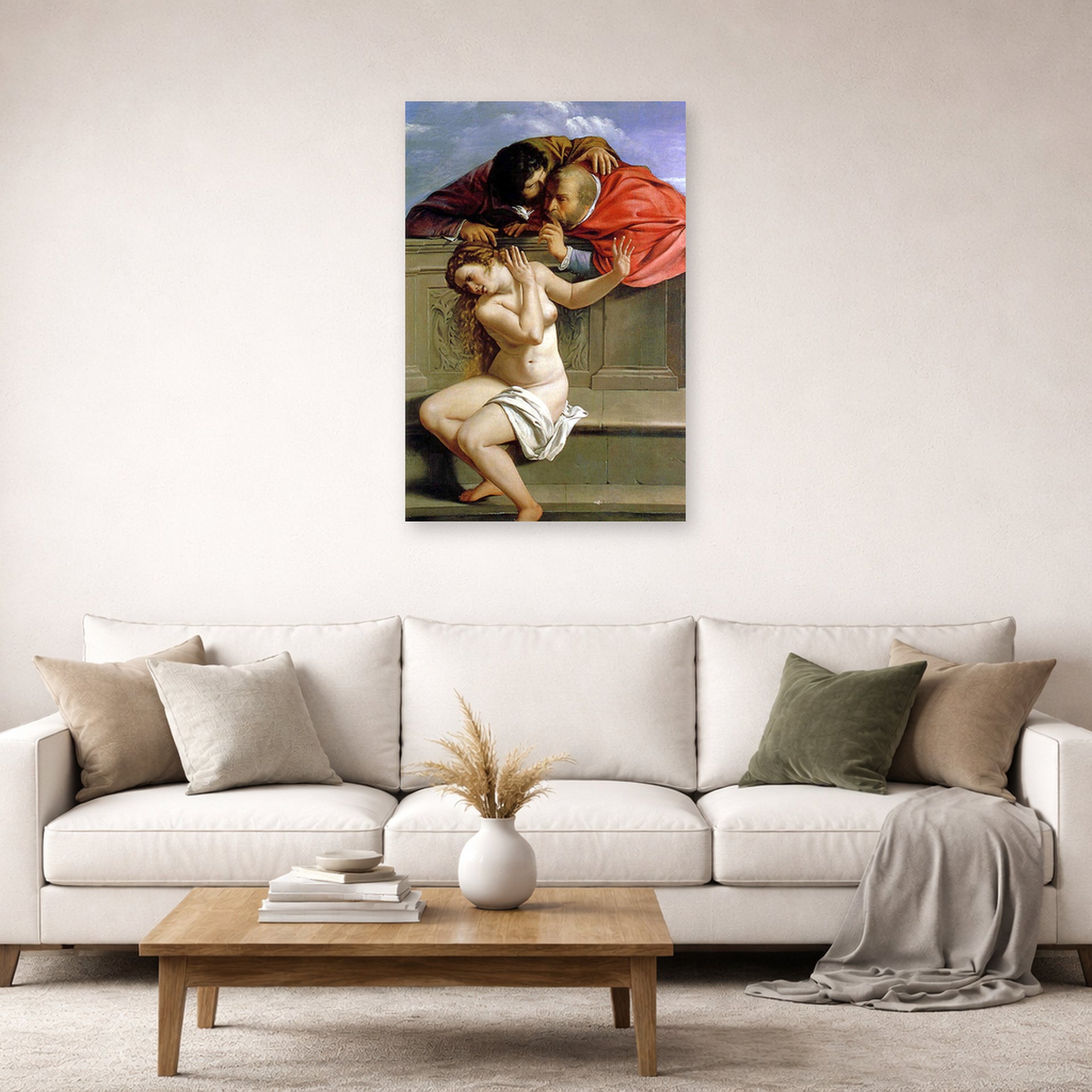 Unframed poster print of Artemisia Gentileschi's Susanna and the Elders displayed on a wall in a living room