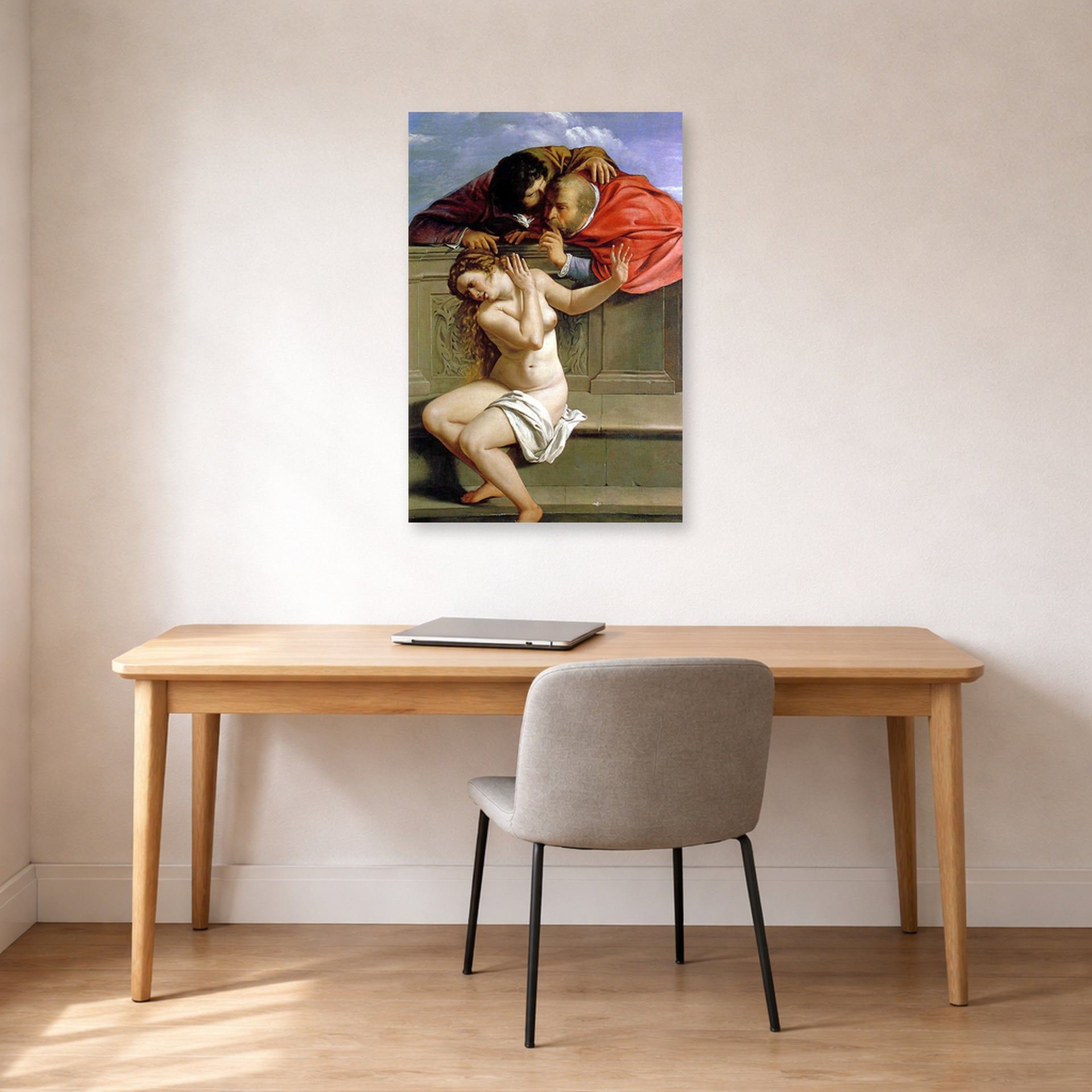 Unframed poster print of Artemisia Gentileschi's Susanna and the Elders displayed on a wall in a home office