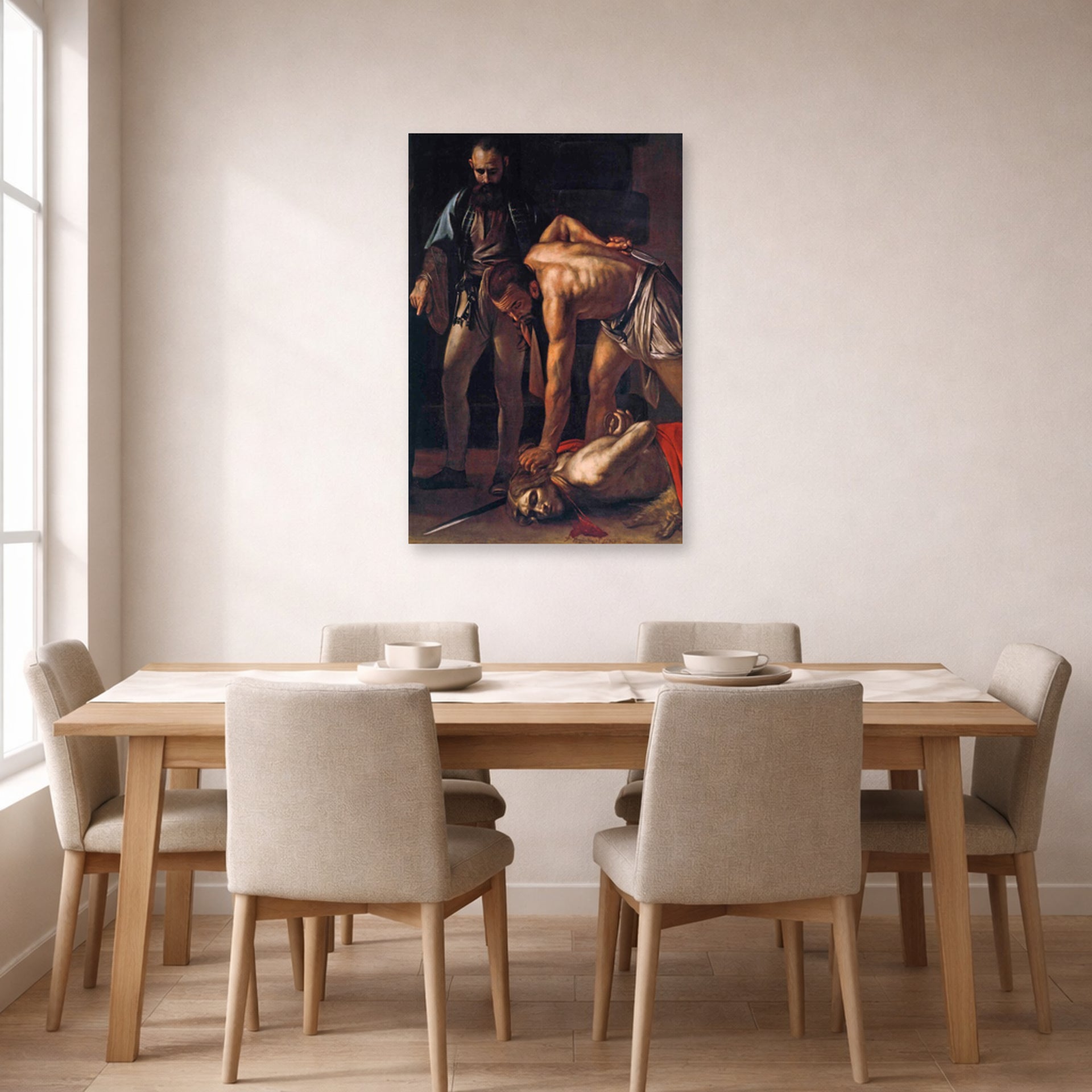 Unframed poster print of Caravaggio's 'Beheading of Saint John the Baptist' displayed on a wall in a dining room
