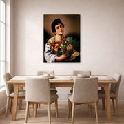 Gallery-wrapped canvas print of Caravaggio's 'Boy with a Basket of Fruit' displayed on a wall in a dining room