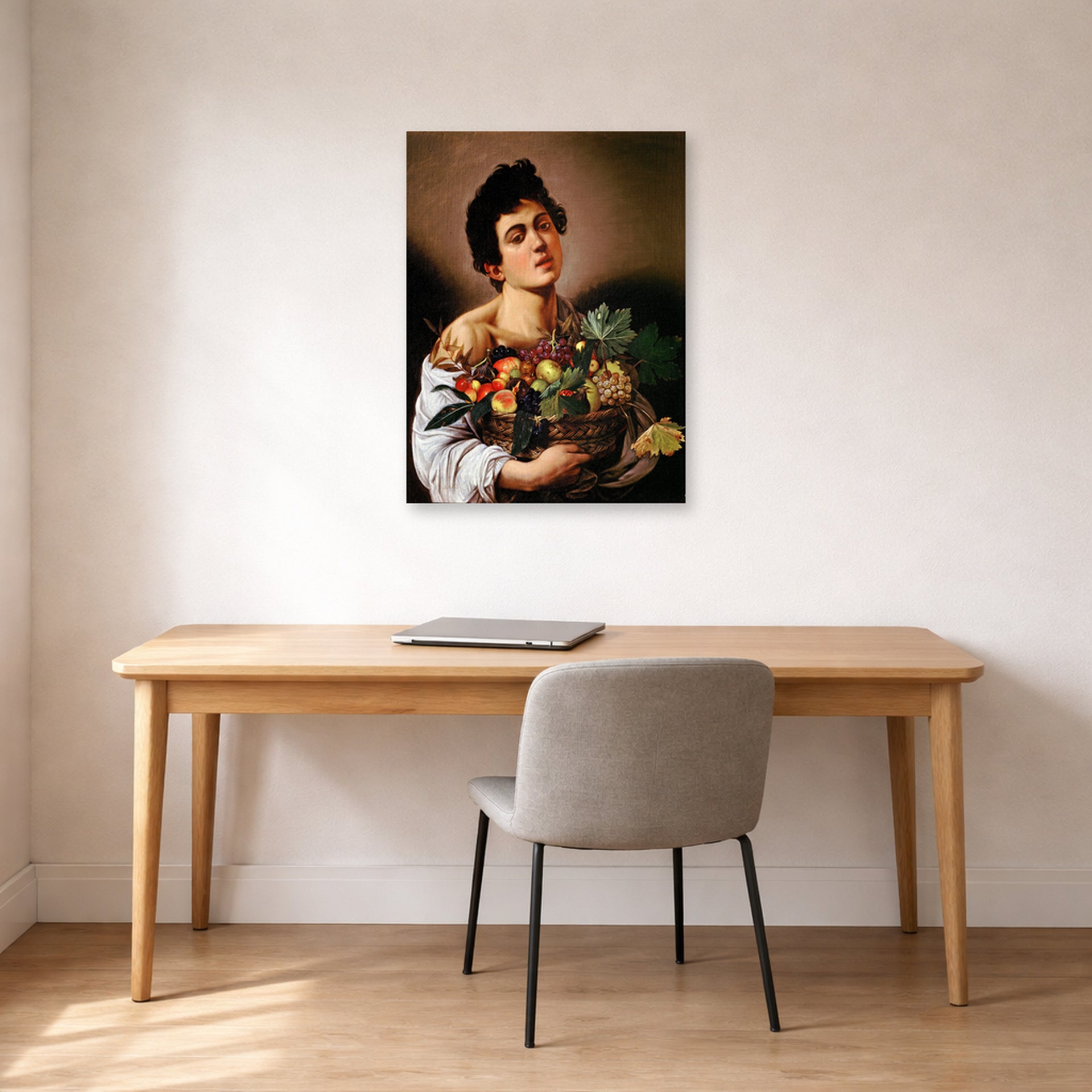 Unframed poster print of Caravaggio's 'Boy with a Basket of Fruit' displayed on a wall in an office