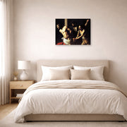 Gallery-wrapped canvas print of Caravaggio's 'Christ of the Column' displayed on a wall in a bedroom