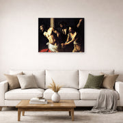 Gallery-wrapped canvas print of Caravaggio's 'Christ of the Column' displayed on a wall in a living room