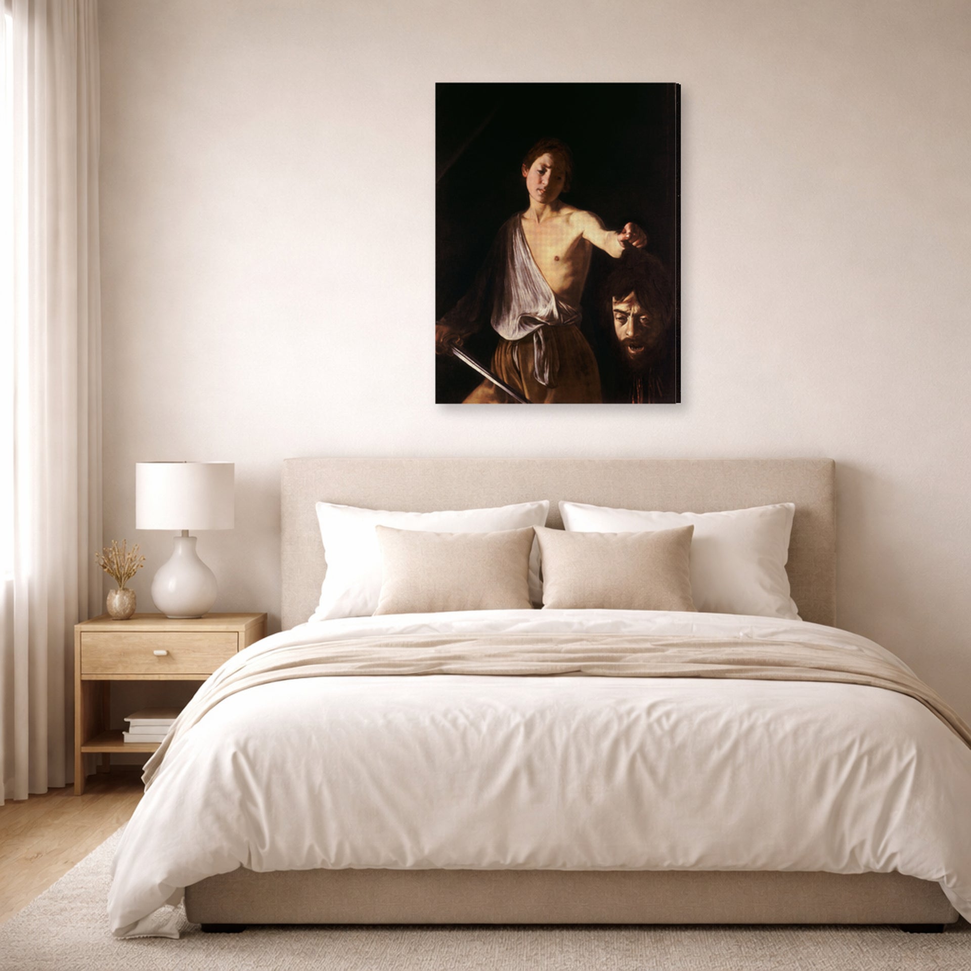 Gallery-wrapped canvas print of Caravaggio's 'David with the Head of Goliath' displayed on a wall in a bedroom