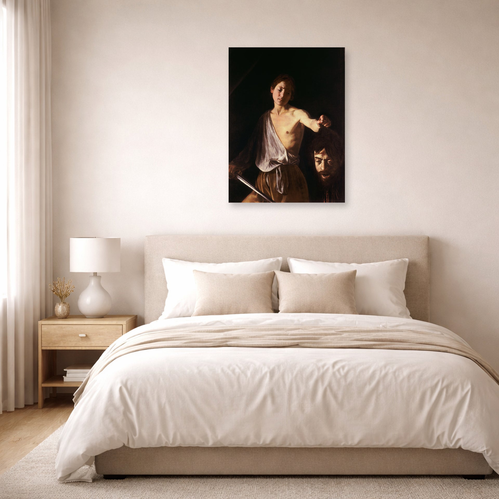 Unframed poster print of Caravaggio's 'David with the Head of Goliath' displayed on a wall in a bedroom