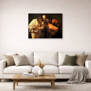 Gallery-wrapped canvas print of Caravaggio's 'Doubting of St.Thomas' displayed on a wall in a living room