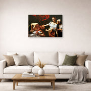 Gallery-wrapped canvas print of Caravaggio's 'Judith Beheading Holofernes' displayed on a wall in a living room