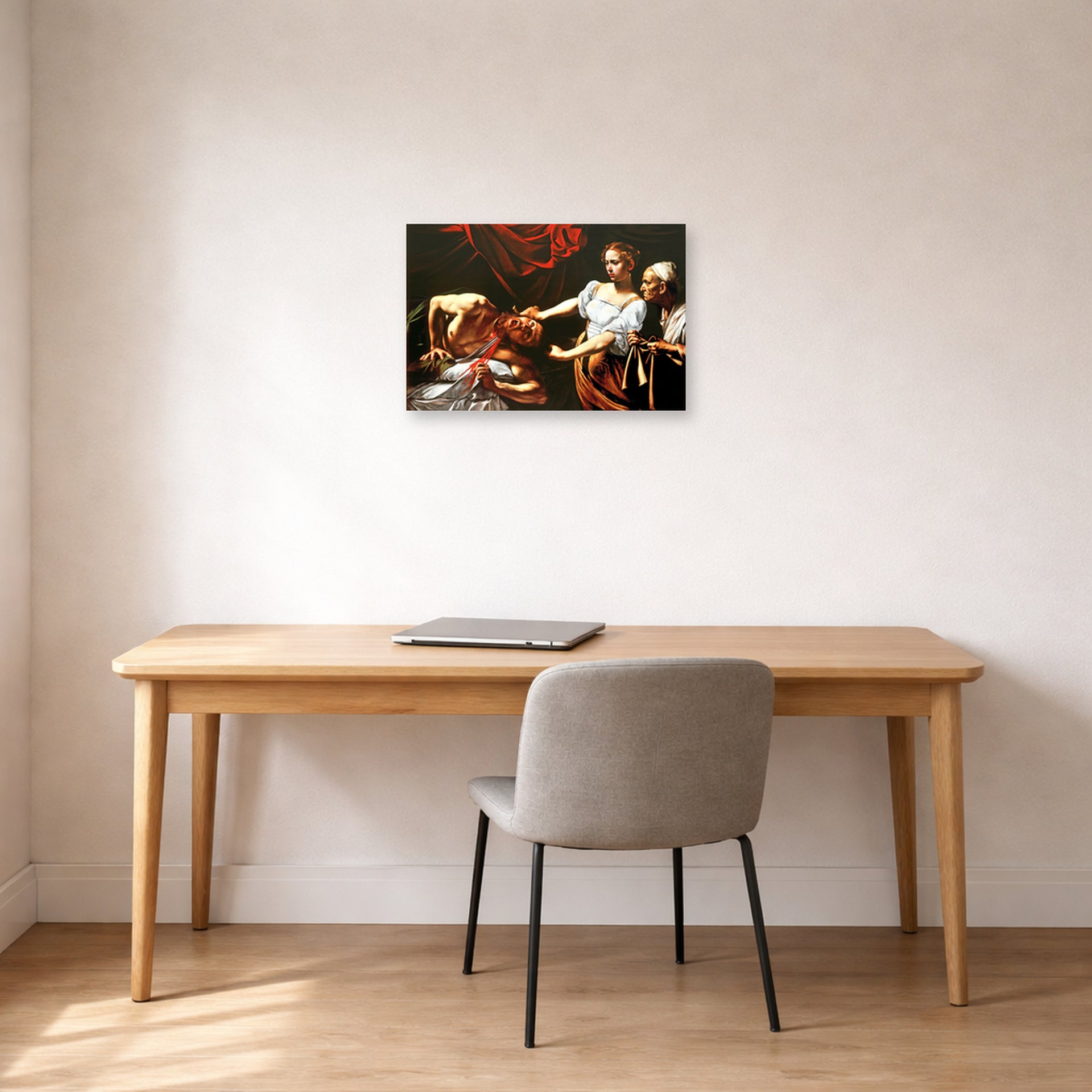 Unframed poster print of Caravaggio's 'Judith Beheading Holofernes' displayed on a wall in an office