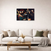 Unframed poster print of Caravaggio's 'Kiss of Judas' displayed on a wall in a living room