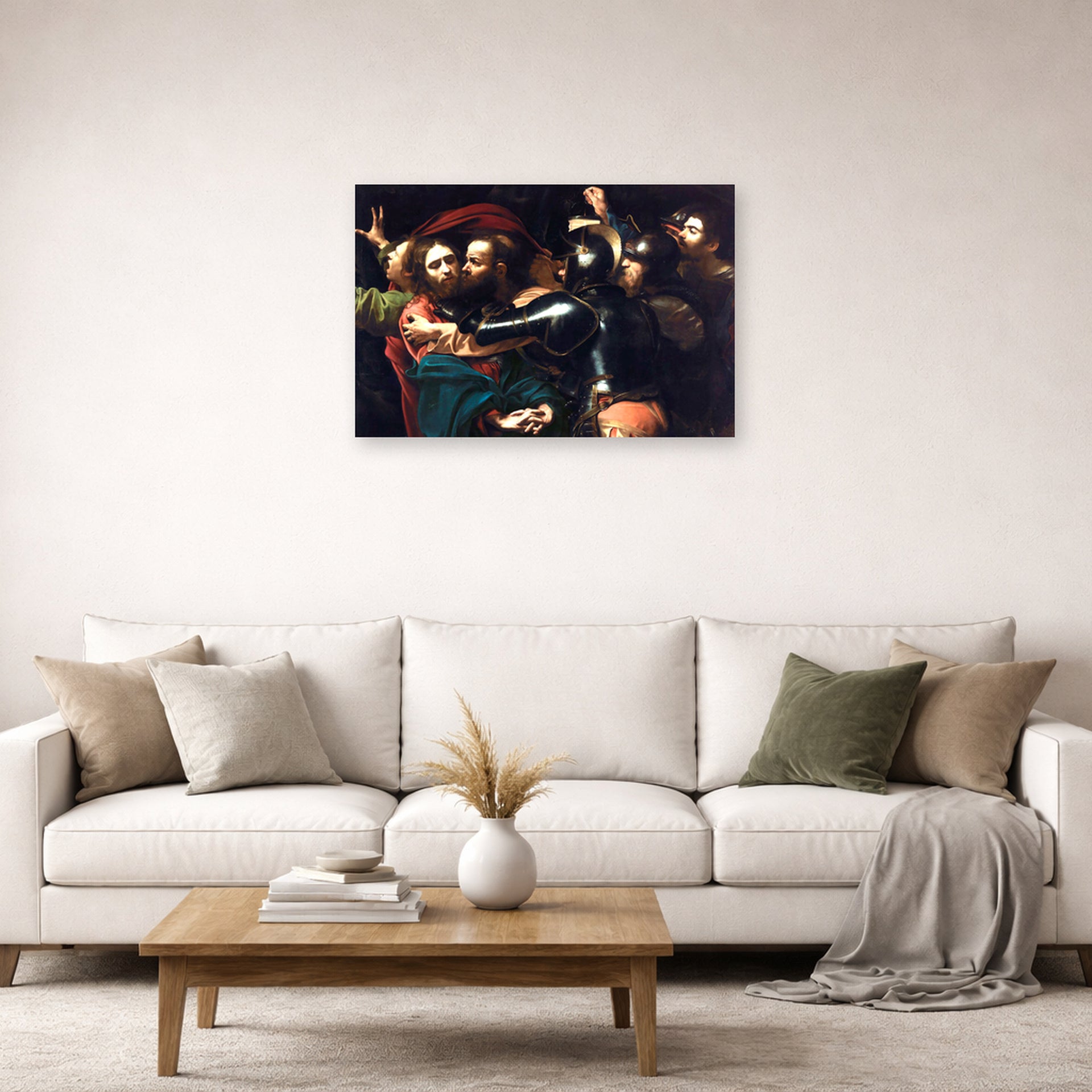 Unframed poster print of Caravaggio's 'Kiss of Judas' displayed on a wall in a living room