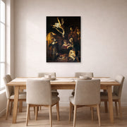 Unframed poster print of Caravaggio's 'Nativity with San Lorenzo and San Francesco' displayed on a wall in a dining room