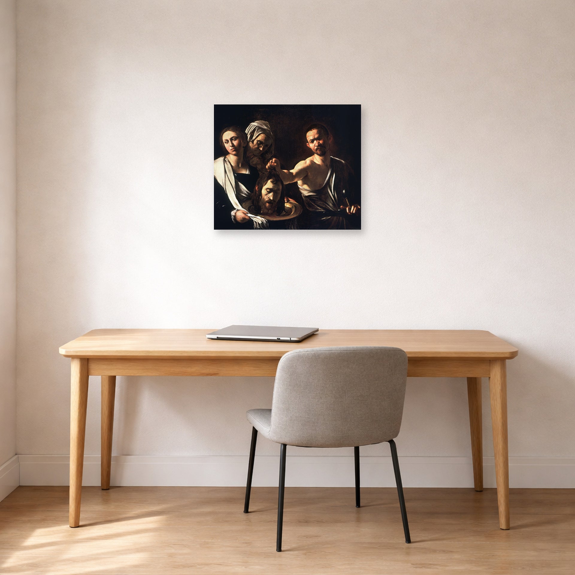 Unframed poster print of Caravaggio's 'Salome with the Head of John the Baptist' displayed on a wall in an office