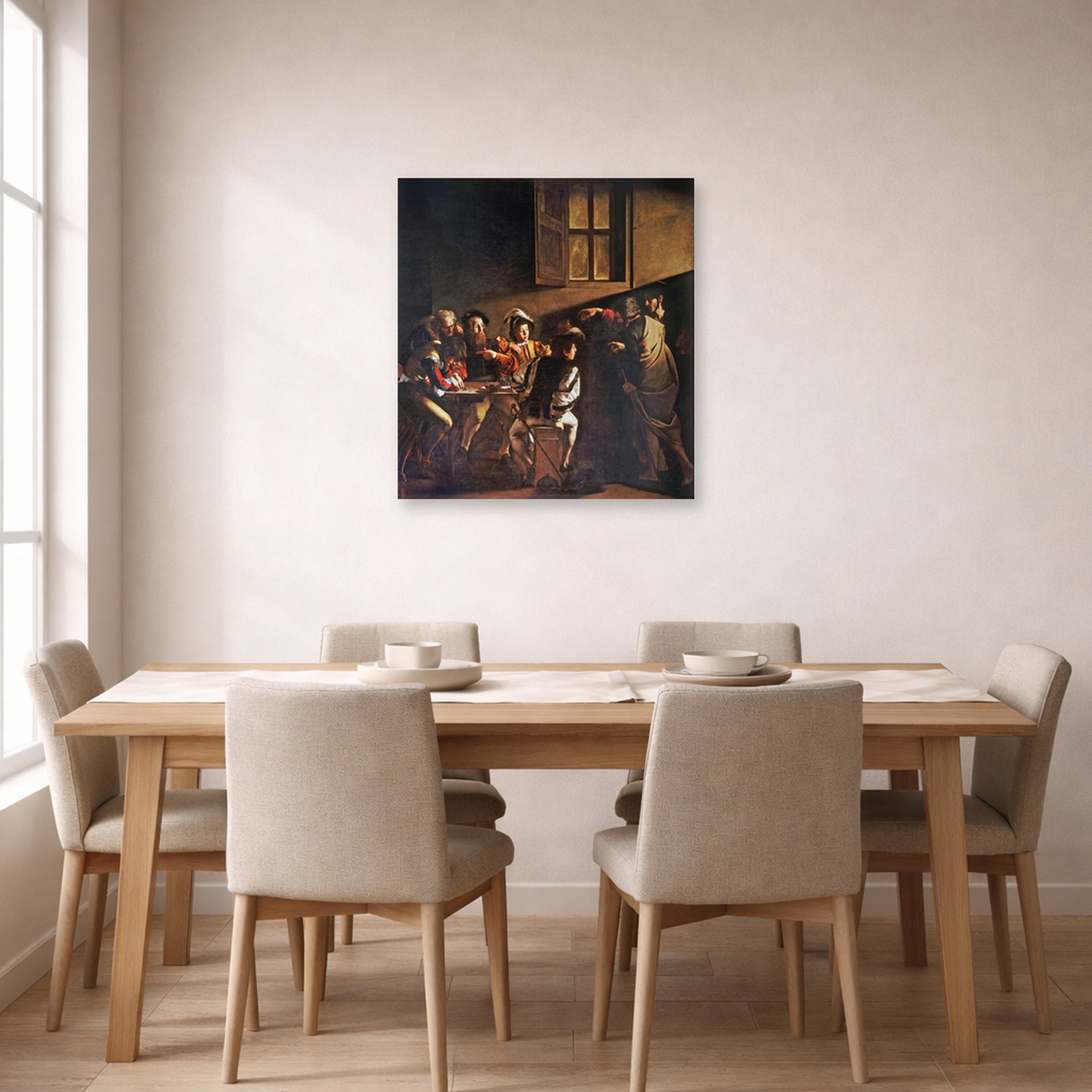 Unframed poster print of Caravaggio's 'The Calling of Saint Matthew' displayed on a wall in a dining room