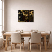 Gallery-wrapped canvas print of Caravaggio's 'The Crowning with Thorns' displayed on a wall in a dining room
