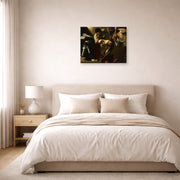 Unframed poster print of Caravaggio's 'The Crowning with Thorns' displayed on a wall in a bedroom