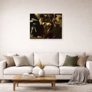 Unframed poster print of Caravaggio's 'The Crowning with Thorns' displayed on a wall in a living room