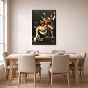 Gallery-wrapped canvas print of Caravaggio's 'The Entombment of Christ' displayed on a wall in a dining room