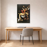 Gallery-wrapped canvas print of Caravaggio's 'The Entombment of Christ' displayed on a wall in an office