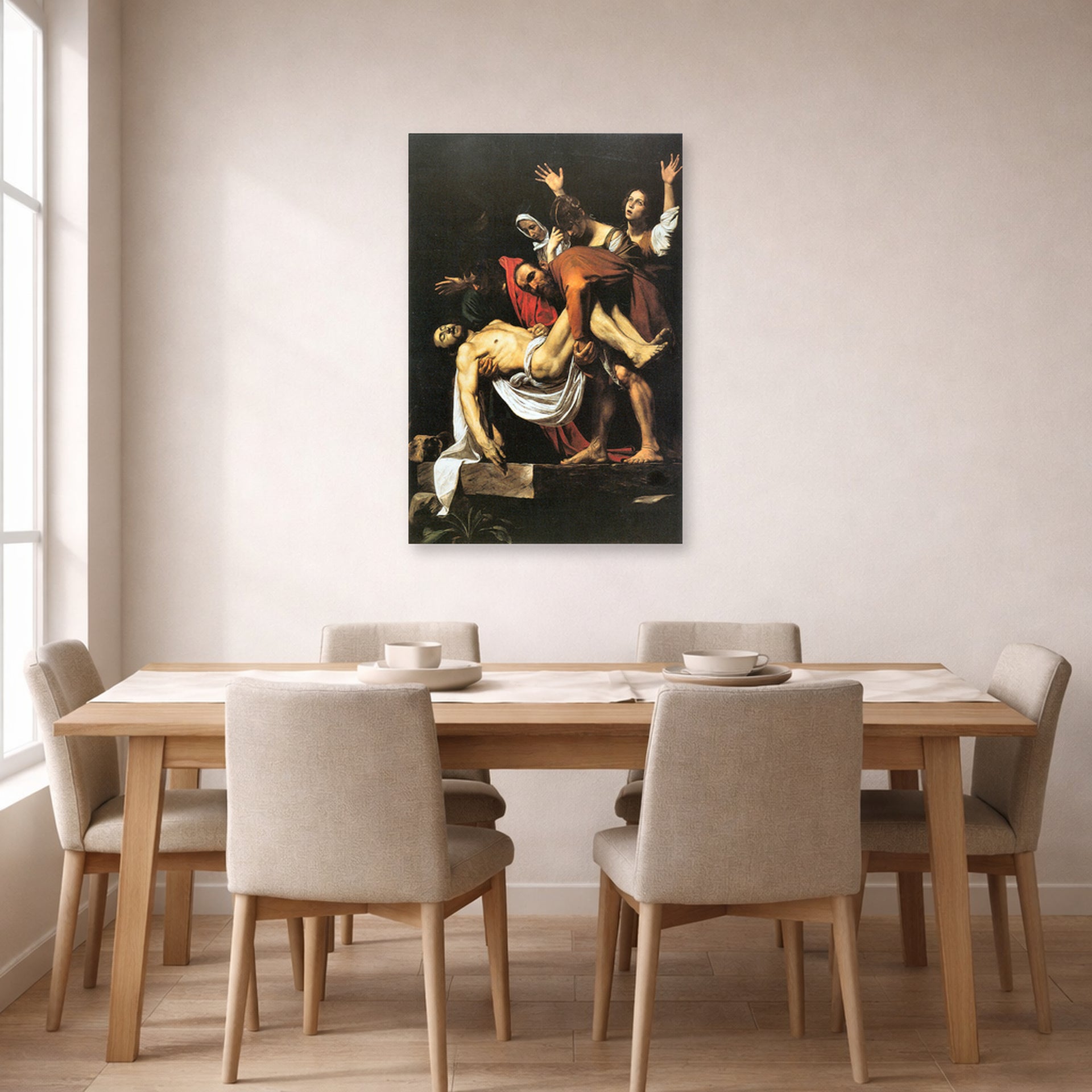 Unframed poster print of Caravaggio's 'The Entombment of Christ' displayed on a wall in a dining room