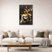 Unframed poster print of Caravaggio's 'The Entombment of Christ' displayed on a wall in a living room
